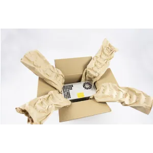 Overhead-view-of-an-open-cardboard-box-containing-a-packaged-item-with-visible-product-labels-surrounded-by-crumpled-kraft-paper-padding
